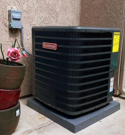 This image shows an outdoor heat pump unit installed beside a residential home in La Cañada Flintridge, CA, resting on a concrete pad near a stucco wall. Green Planet HVAC provides emergency heat pump repair in La Cañada Flintridge, CA, helping homeowners fix heating system issues quickly and safely. The unit is connected to an electrical box and positioned near a small plant, which reflects a typical home HVAC setup in the area. Homeowners in La Cañada Flintridge can contact Green Planet HVAC at (818) 383-6516 for emergency heat pump repair services and system support.